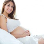 Pregnant woman relaxing at home.