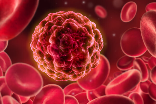 Illustration einer Krebszelle zwischen roten Blutkörpern